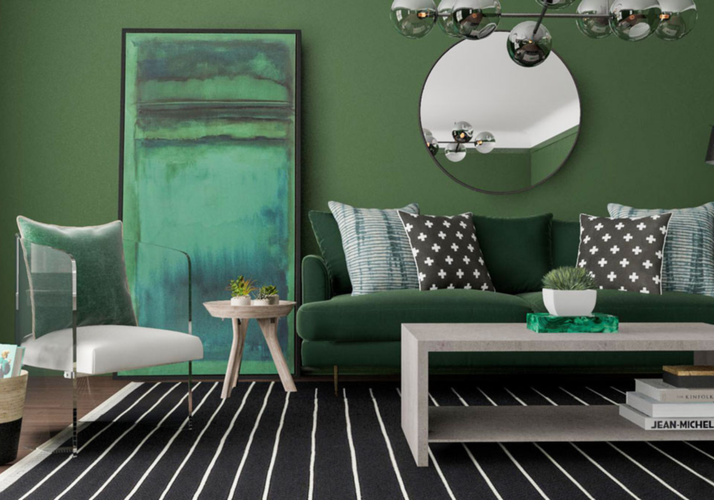 green sofa with green wall, green artwork, green cushion on a white chair, white coffee table and black rug underneath