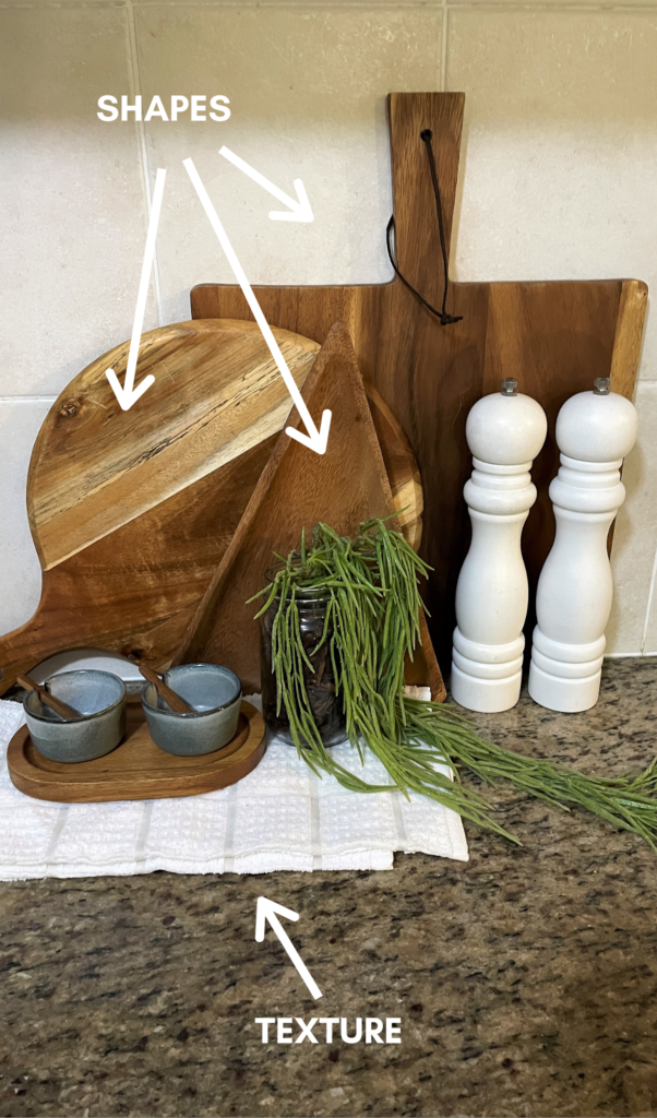 differently shaped cutting boards with a tea towel underneath as a base