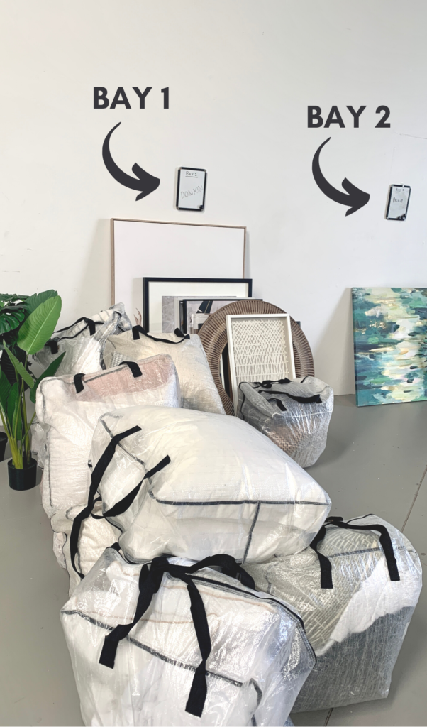 bays in our warehoues with linen bags and artwork in front