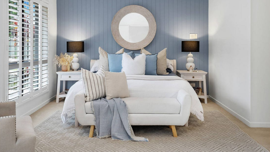 master bedroom styled in a light sky blue colour