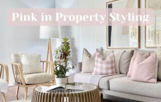 Pink property styling, pink in home staging - a white and cream living room with pink accents