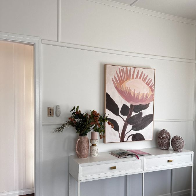 Pink in Property Styling - a native Australian flower artwork, with pink accents.